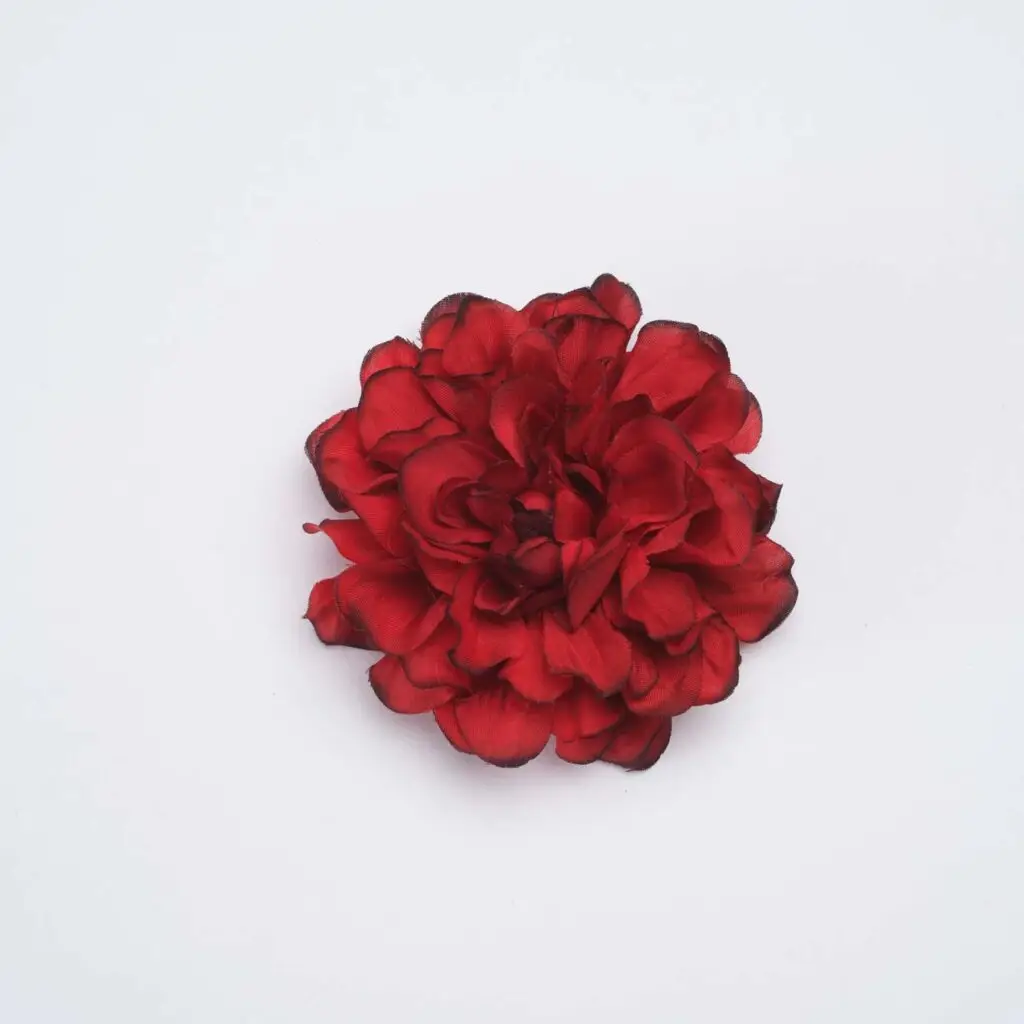 Flor de flamenca roja con bordes oscuros para peinados de moda flamenca